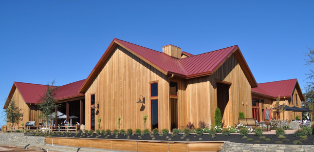 Red standing seam roof installed by Pruden Roofing at Oak Farm Vineyards in Lodi, California.