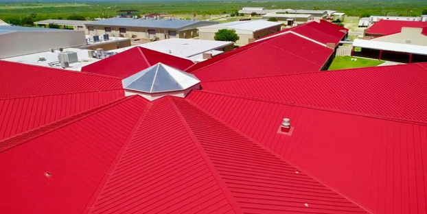 Rio Roofing installed this red standing seam metal roof for Roma High School in Roma, Texas.