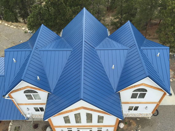Blue standing seam roof with panels prepared by the Swenson Shear SnapTable PRO